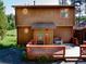 Inviting front porch with seating, decorative touches, and a charming exterior at 10858 Norton Ave, Conifer, CO 80433
