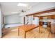 Well-lit kitchen area with wooden cabinets, modern appliances, and wood flooring, perfect for home cooking at 10858 Norton Ave, Conifer, CO 80433