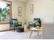 Living room with large window offering scenic views and comfortable seating at 10858 Norton Ave, Conifer, CO 80433