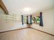 Bright, versatile room with tiled floors, exposed beam and natural light from outdoor views at 10858 Norton Ave, Conifer, CO 80433