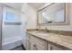 Classic bathroom with a tub/shower combination and a granite-topped vanity at 11328 W 27Th Ave, Lakewood, CO 80215