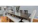 Formal dining area with wood floors, an expansive dining table, and stylish seating ideal for Gathering gatherings at 11328 W 27Th Ave, Lakewood, CO 80215