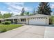 Charming single-story home features a well-maintained lawn, attached two-car garage, and welcoming curb appeal at 11328 W 27Th Ave, Lakewood, CO 80215