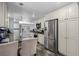Spacious kitchen with stainless steel appliances, sleek countertops, and ample cabinet space for cooking and entertaining at 11328 W 27Th Ave, Lakewood, CO 80215