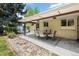 Relaxing covered patio space complete with an outdoor dining set, ideal for entertaining at 11328 W 27Th Ave, Lakewood, CO 80215