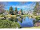 Scenic pond surrounded by trees and greenery, creating a serene natural landscape at 3022 S Wheeling Way # 205, Aurora, CO 80014