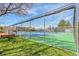 Well-maintained tennis court surrounded by a chain-link fence; perfect for recreation at 3022 S Wheeling Way # 205, Aurora, CO 80014