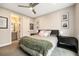 Inviting bedroom with a ceiling fan and an ensuite bathroom at 2695 W Grand Ave, Littleton, CO 80123