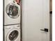 Efficient laundry area with stacked washer and dryer at 2695 W Grand Ave, Littleton, CO 80123