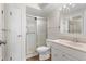 Bathroom features tile flooring and shower with glass door at 3082 S Wheeling Way # 106, Aurora, CO 80014