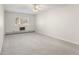 Spacious bedroom with neutral carpet, ceiling fan and window at 3082 S Wheeling Way # 106, Aurora, CO 80014