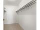 Walk-in closet provides ample storage with rod and shelving at 3082 S Wheeling Way # 106, Aurora, CO 80014