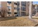 Exterior view shows the building and surrounding greenery at 3082 S Wheeling Way # 106, Aurora, CO 80014