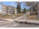 Well-maintained building exterior surrounded by trees and landscaping at 3082 S Wheeling Way # 106, Aurora, CO 80014