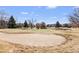 Beautiful golf course view with sand trap, green, mature trees, and water feature in the background at 3082 S Wheeling Way # 106, Aurora, CO 80014