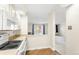 Open kitchen design with eat in bar and view to the living room and neighborhood view at 3082 S Wheeling Way # 106, Aurora, CO 80014