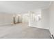 Open-concept living room with modern lighting, and view into the kitchen at 3082 S Wheeling Way # 106, Aurora, CO 80014