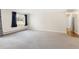 Large open living room with carpet and trim and open access to other rooms in the residence at 3082 S Wheeling Way # 106, Aurora, CO 80014