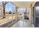 Bright sunroom with tiled floor and sliding door access to the outside with lovely view at 3082 S Wheeling Way # 106, Aurora, CO 80014