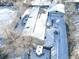 Aerial view of a house and detached garage in snowy landscape at 846 S Sheridan Blvd, Denver, CO 80226