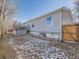 View of home's back, showing deck and yard at 846 S Sheridan Blvd, Denver, CO 80226