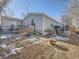 Backyard with fire pit and partial home view at 846 S Sheridan Blvd, Denver, CO 80226