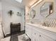 Modern bathroom with double vanity and stylish tilework at 846 S Sheridan Blvd, Denver, CO 80226