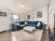 Open living room with sectional sofa and modern decor at 846 S Sheridan Blvd, Denver, CO 80226