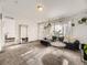 Living room with dark gray sectional sofa and entryway at 846 S Sheridan Blvd, Denver, CO 80226