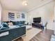 Spacious living room featuring a sectional sofa and hardwood floors at 846 S Sheridan Blvd, Denver, CO 80226