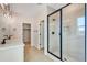 Contemporary bathroom featuring tiled shower with glass door at 6882 Oak Canyon Cir, Castle Pines, CO 80108