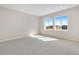 Bright bedroom with two large windows offering natural light at 6882 Oak Canyon Cir, Castle Pines, CO 80108