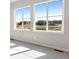 Bedroom filled with natural light from windows with views of the neighborhood at 6882 Oak Canyon Cir, Castle Pines, CO 80108