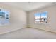 Bedroom with abundant natural light and views of nearby houses at 6882 Oak Canyon Cir, Castle Pines, CO 80108