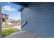View of the horizontal blue siding and a street view from the porch at 6882 Oak Canyon Cir, Castle Pines, CO 80108
