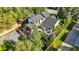 Aerial view of a stylish home with a deck, patio, well-maintained yard, and lush greenery at 1801 Redwood Ave, Boulder, CO 80304