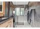 Contemporary bathroom featuring a glass-enclosed shower, stylish fixtures, and elegant tile work at 1801 Redwood Ave, Boulder, CO 80304