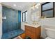 Bright bathroom with a sleek glass shower, modern vanity, stylish mirror, and contemporary fixtures at 1801 Redwood Ave, Boulder, CO 80304