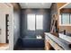 Bathroom featuring a black free-standing tub and a stylish vanity at 1801 Redwood Ave, Boulder, CO 80304