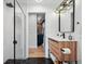 Stylish bathroom featuring modern shower with geometric tile and wood vanity at 1801 Redwood Ave, Boulder, CO 80304