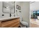 Modern bathroom with sleek wood vanity, black fixtures, and contemporary design at 1801 Redwood Ave, Boulder, CO 80304