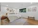 Cozy bedroom with a large rug, bright light from the window, and simple decorations at 1801 Redwood Ave, Boulder, CO 80304