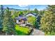 Beautiful home showcasing a manicured lawn, mature trees, and a welcoming front porch, radiating curb appeal at 1801 Redwood Ave, Boulder, CO 80304