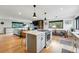 Modern kitchen with a spacious island, a cooktop, and a seamless transition into the living areas at 1801 Redwood Ave, Boulder, CO 80304