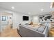Open-concept living room with neutral walls, a flat screen TV, and hardwood floors at 1801 Redwood Ave, Boulder, CO 80304