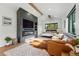 Bright main bedroom featuring accent wall with fireplace and media center at 1801 Redwood Ave, Boulder, CO 80304