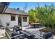 Cozy backyard patio featuring comfortable seating, a modern fire pit, and a dining area, perfect for outdoor gatherings at 1801 Redwood Ave, Boulder, CO 80304