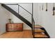 Modern staircase with metal railings and stylish wood accents at 1801 Redwood Ave, Boulder, CO 80304
