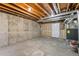 Unfinished basement area with utility area at 3300 W Florida Ave # 77, Denver, CO 80219