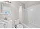 Clean bathroom with white vanity, tub, and shower at 3300 W Florida Ave # 77, Denver, CO 80219